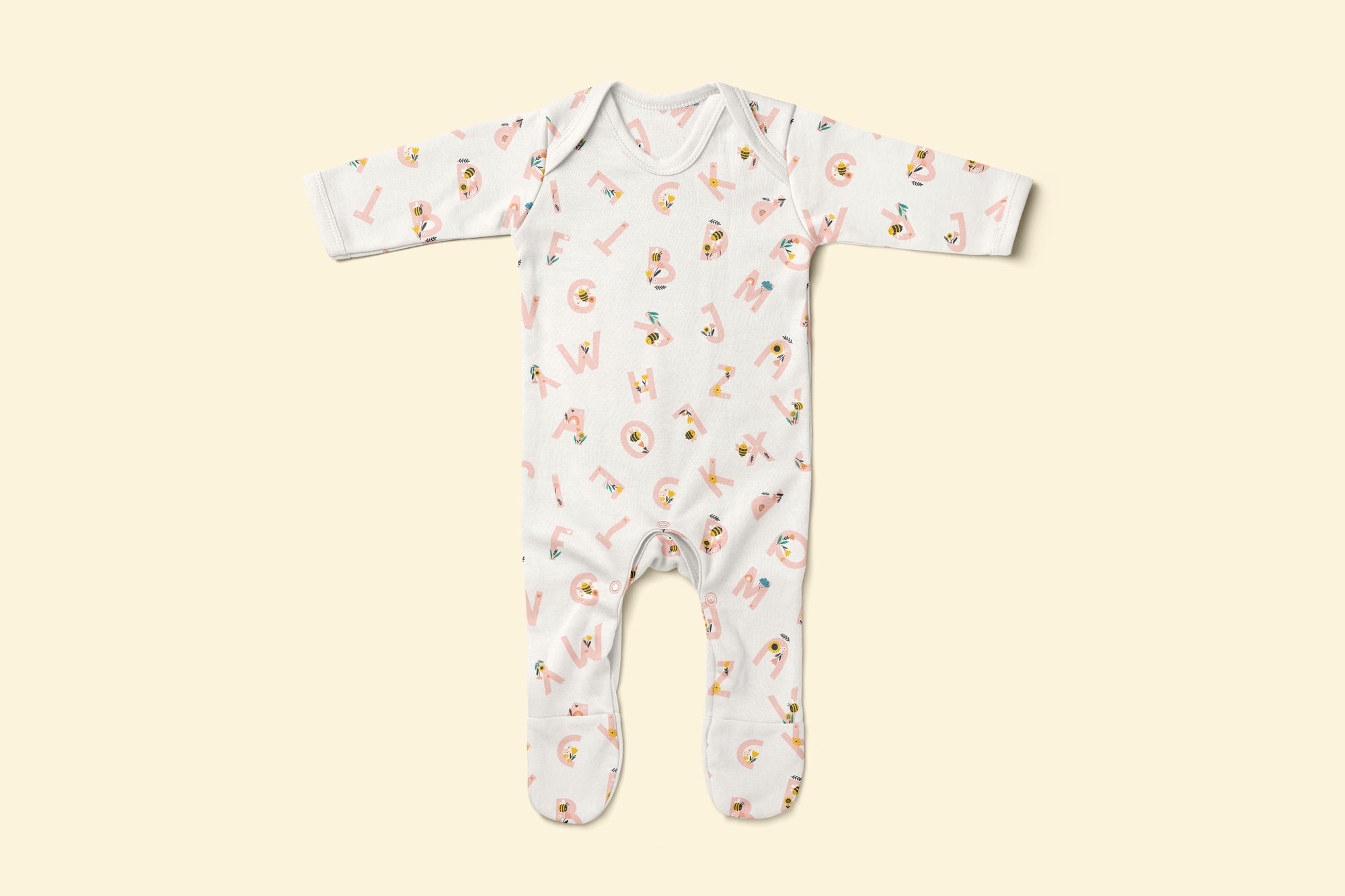 Baby rompersuit with pink alphabet pattern