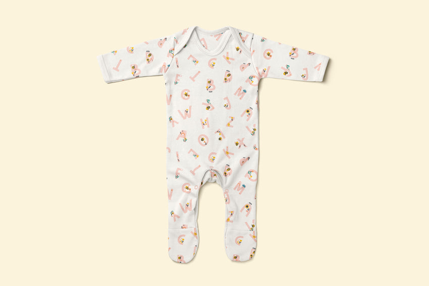 Baby rompersuit with pink alphabet pattern