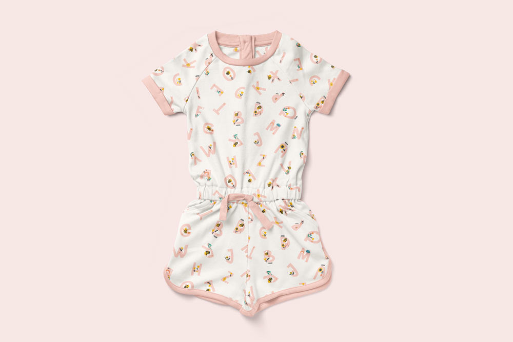 Honey to the Bee cotton playsuit with pink alphabet print