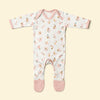 Baby rompersuit with pink alphabet pattern and pink accents